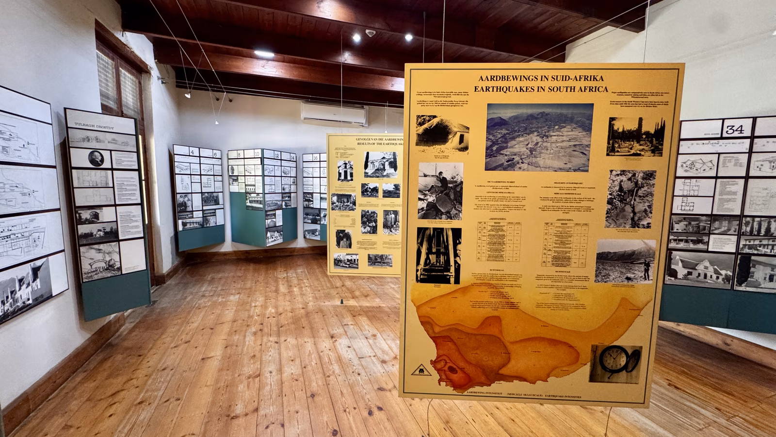 Earthquake Museum — display boards on the 1969 earthquake lining a wood-floored gallery