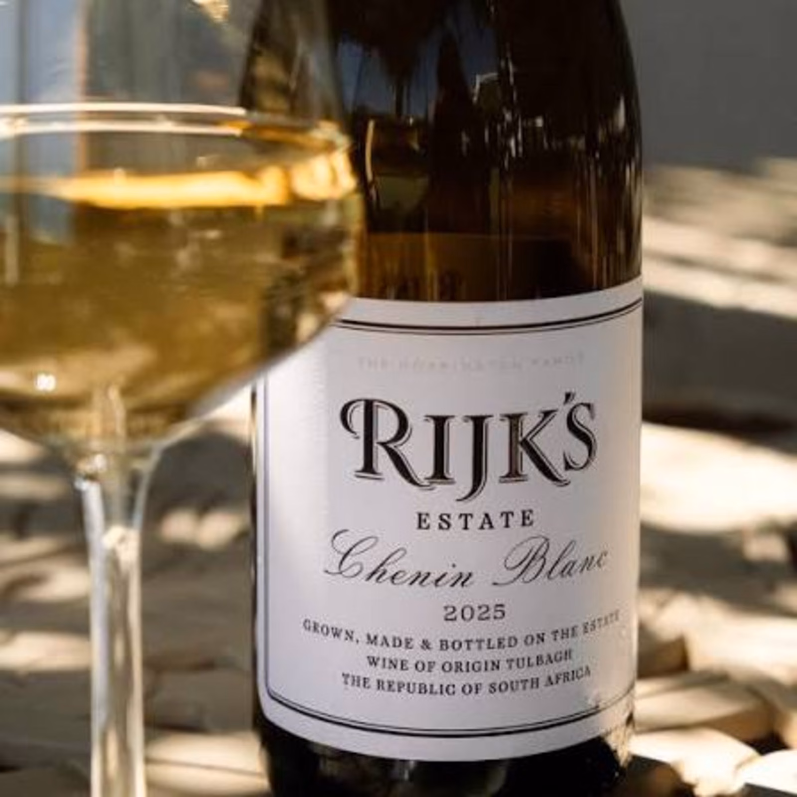 Rijk's — a bottle of Rijk's Estate Chenin Blanc beside a filled glass in the sun